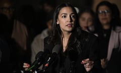 Congresswoman Alexandria Ocasio-Cortez at a microphone.