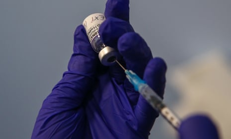 Close-up of someone preparing a dose of Covid vaccine
