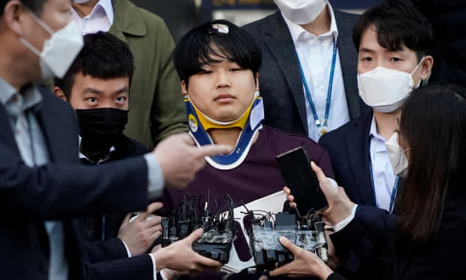 Cho Ju-bin, alleged leader of South Korea’s online sexual blackmail ring, walks out of a police station as he is transferred to a prosecutor’s office in Seoul
