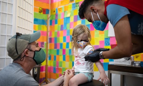 Sophia Giemza, three, is given a band-aid after receiving the Moderna vaccine in Schwenksville, Pennsylvania.