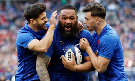 France’s Uini Atonio (centre) celebrates scoring their third try with teammates.