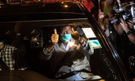 Hong Kong pro-democracy media tycoon and Apple Daily founder Jimmy Lai leaves Mong Kok police station after being released on bail on Wednesday.