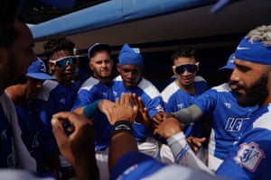 Players from the Industriales baseball team cheer before a match at the Latinoamericano stadium