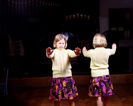 A child with her arms stretched out.
