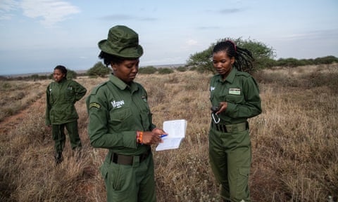 Sharon Nankinyi, centre, on patrol with Purity Amleset, right, of the International Fund for Animal Welfare’s Team Lioness