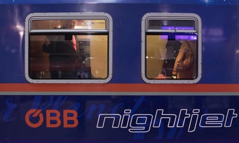 Passengers board the first night train heading to Brussels before its departure on 19 January.