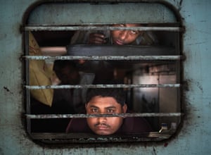 Two men looking through a train window, Jaipur, Rajasthan, India
