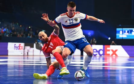 Russia’s Ivan Chishkala tries to get away from Elisandro Teixeira Gomes of Georgia during their quarter-final.