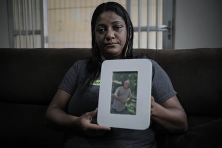 a women holding a photo