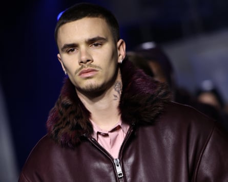 Romeo Beckham in a fur-trimmed leather bomber jacket during Burberry's autumn/winter 2026 collection, at London fashion week, 23 February 2026.