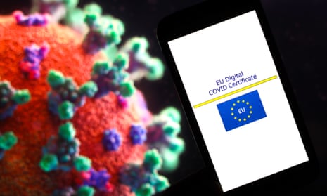 EU Digital Covid vaccination Certificate logo seen displayed in front of an image of a coronavirus.