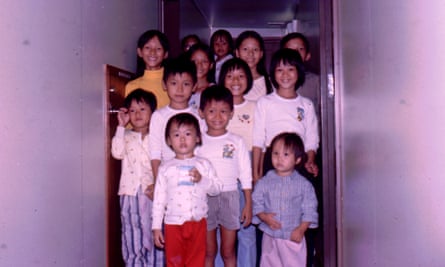 ‘For us, the crew were heroes’: Diep Quan, middle row far right, with her sister. They are pictured on the Wellpark after being rescued.