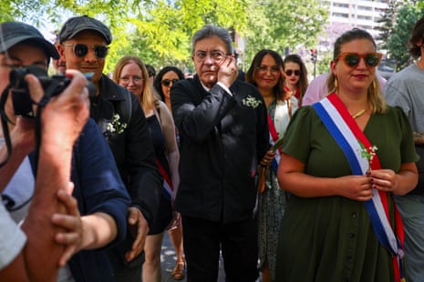 Traditional May Day labour union march in ParisLeader of French far-left opposition party La France Insoumise (LFI) Jean-Luc Melenchon and President of the La France Insoumise group in the National Assembly Mathilde Panot walk as they attend the traditional May Day labour union march in Paris, France, May 1, 2025. REUTERS/Gonzalo Fuentes