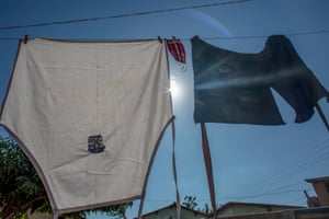 A face mask is seen hang out to dry with work aprons in Glen View 8, Harare.