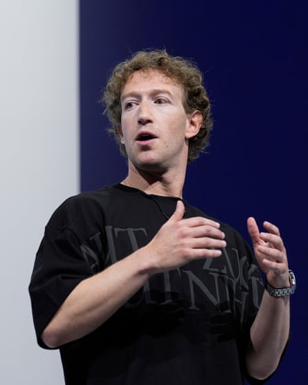 Mark Zuckerberg wearing a baggy T-shirt gestures while he speaks