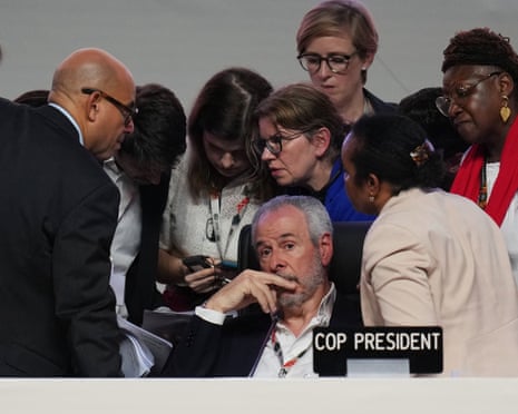 Cop30 president, André Corrêa do Lago, sits surrounded by UN officials during a plenary session of the climate summit