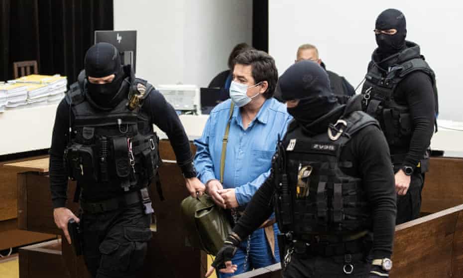 Marian Kocner is escorted for a public hearing at Slovakia’s supreme court in relation to the murder of Ján Kuciak and his fiancee, Martina Kušnírová, in Bratislava on 15 June.