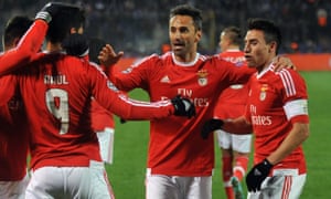 Benfica’s players celebrate their equalising goal, which will put them through to the next round.