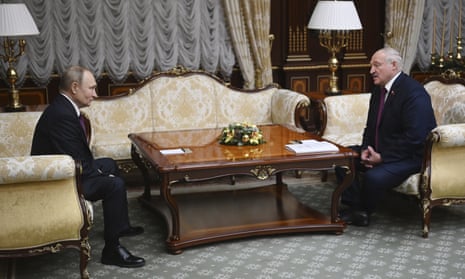 Putin and Lukashenko talk during their meeting in Minsk.
