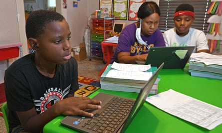 kids and mother look at computer screens