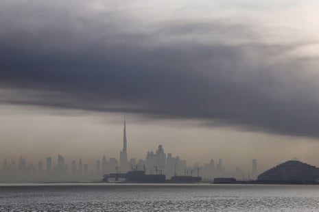Smoke is seen above Dubai today. Explosions rattled buildings and a large cloud of smoke hangs over a central area of the Middle East financial hub.