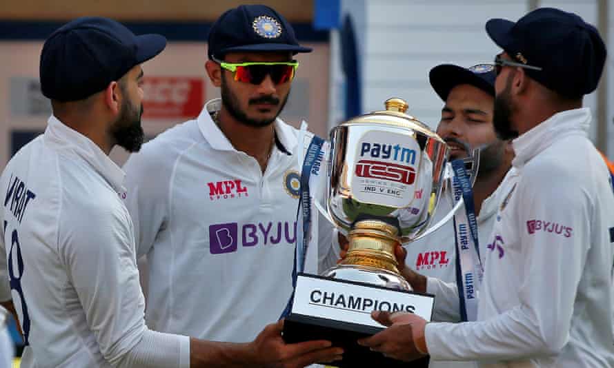 Virat Kohli, Axar Patel, Rishabh Pant and Mohammed Siraj hold the series trophy.