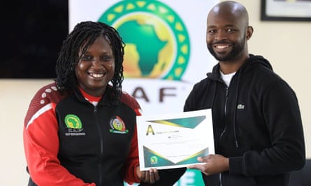 Jackline Juma receives her A Licence certificate from the Kenyan FA’s chief executive, Barry Otieno, in May.