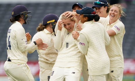 Sophie Ecclestone is mobbed by her teammates during an imperious bowling display in Bristol.