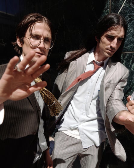 Smith and Caulfield wearing suits