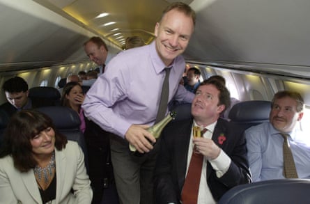 Sting serves champagne to fellow passengers including Piers Morgan as Concorde making its first commercial flight from London to New York after the aircraft were grounded following the crash near Paris in July 2000.