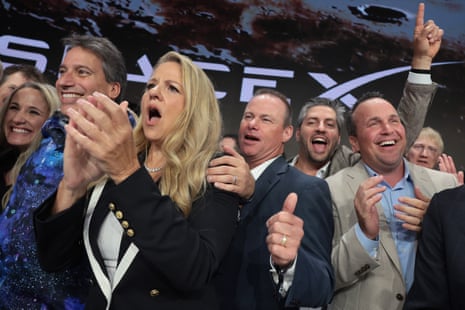 Gwynne Shotwell (centre-left), President of SpaceX, is joined by company leadership as they ring the opening bell at the Nasdaq Marketsite at the launch of the company's initial public offering (IPO) on June 12, 2026 in New York City. SpaceX is set to begin trading under the ticker SPCX following what is expected to be the largest initial public offering in history. Elon Musk, who also serves as chief executive of Tesla, could become the world's first trillionaire. In a filing with the Securities and Exchange Commission, the company said it plans to raise $75 billion by selling 555.6 million shares at $135 each. (Photo by Spencer Platt/Getty Images)