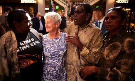 Deborah Worsley, second left, whose father acquired the collection, meets members of the Anindilyakwa community, from left, Maicie Lalara, Amethea Mamarika and Noeleen Lalara, in Manchester