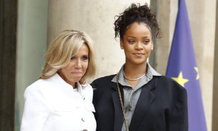 Brigitte Macron greets Rihanna at the palace.