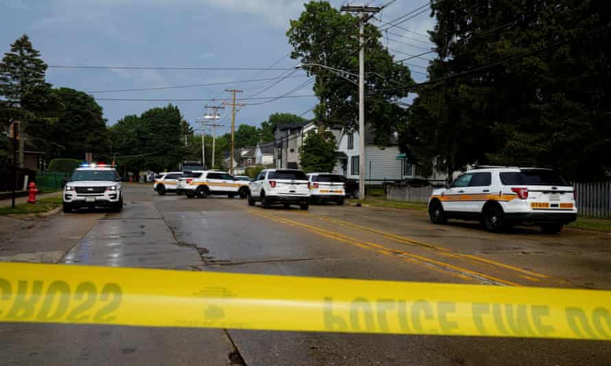 Police investigate outside the home of the mother of the man detained after a mass shooting at a Fourth of July parade route in the Chicago suburb of Highland Park