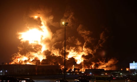 A cloud of smoke rises from a burning oil depot in Jeddah, Saudi Arabia.