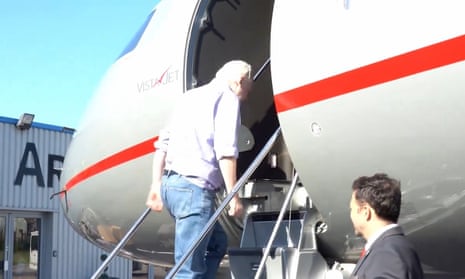 Julian Assange boards flight after release from prison, according to WikiLeaks video – video | Julian Assange | The Guardian
