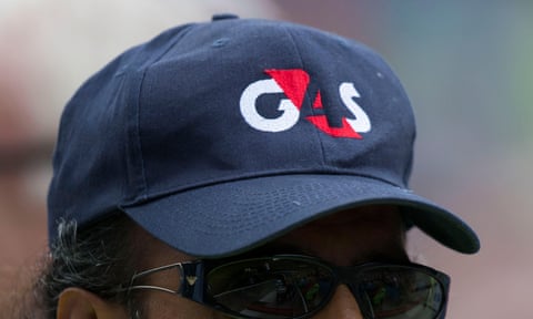 Man in a G4S cap with the company logo