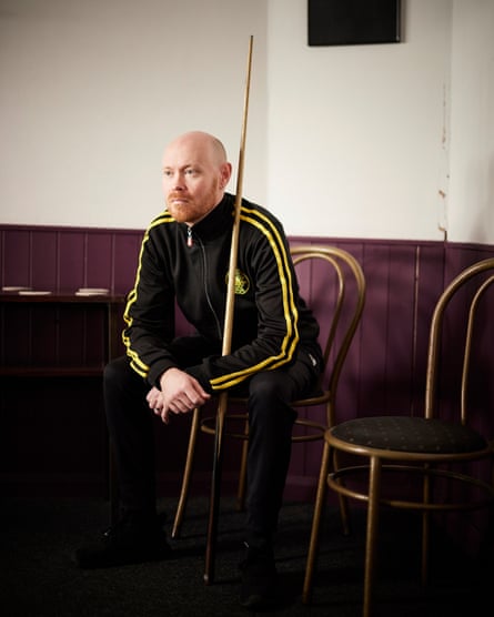 Gary Wilson looks across his North Shields club while sitting and holding his cue
