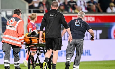 Heidenheim goalkeeper Kevin Müller is carried off on a stretcher after colliding with Bochum’s Ibrahima Sissoko.
