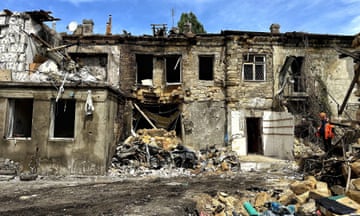 Houses with blown out windows and partially collapsed entrances in Odesa