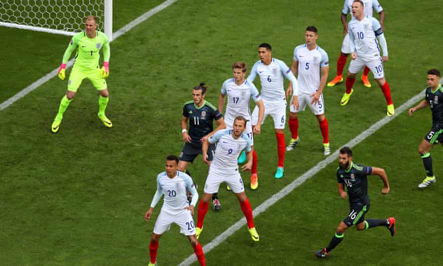 England players defend a free-kick during the group match at Lens, where Wales led 1-0 but lost 2-1