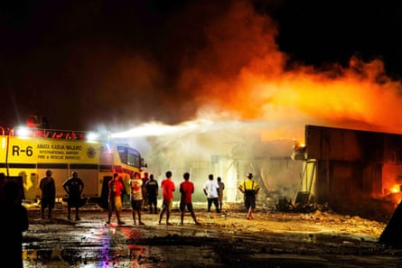 Locals watch as fire destroys the Nitijela parliament building in Majuro