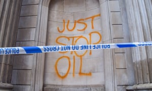 'Just Stop Oil' sprayed with orange paint on the Bank of England.