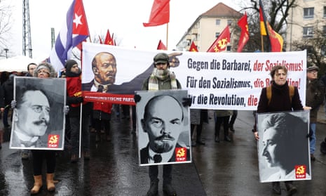A procession of leftwing radicals march to Friedrichsfelde cemetery in Berlin to commemorate the 100th anniversary of the murder of Rosa Luxemburg and Karl Liebknecht