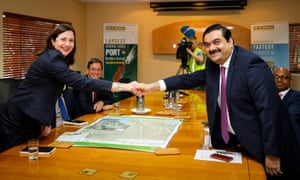 Adani Group chairman Gautam Adani meets with Queensland premier Annastacia Palaszczuk at the Port of Townsville, Tuesday, Dec. 6, 2016. The Queensland government has been given an “iron clad” guarantee from Indian mining giant Adani that it will not use 457 visas at its Carmichael mine and will prioritise local workers. (AAP Image/ Cameron Laird) NO ARCHIVING