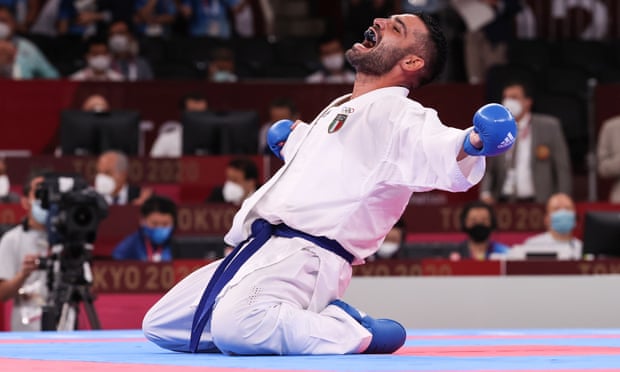 Luigi Busà celebrates after defeating Rafael Aghayev in the men’s 75kg karate final