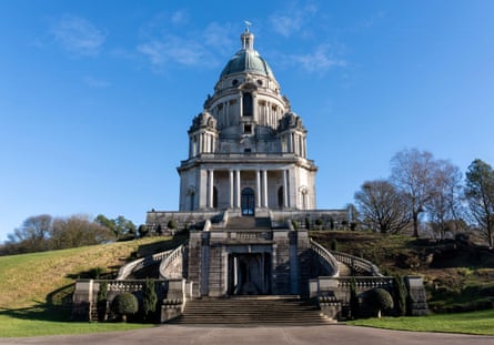 A stone domed building on a hill in a park