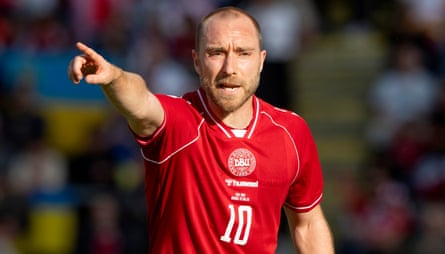 Christian Eriksen points during the friendly against Ukraine before his collapse.