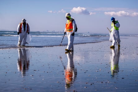 Environmental cleanup crews clean oil chucks