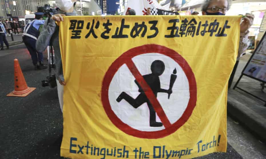 Protesters march in Tokyo last week to call for the cancellation of the Olympics.